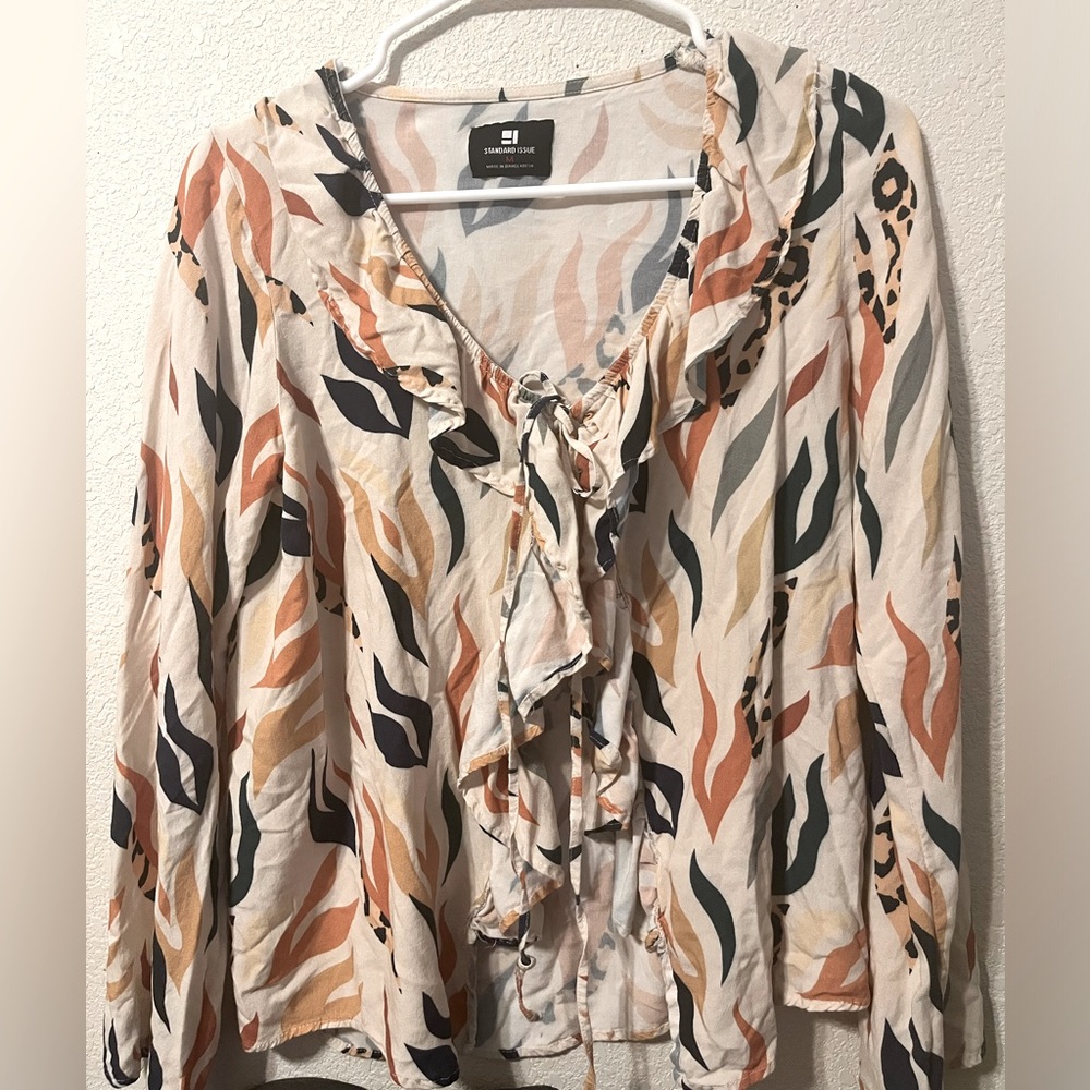 Ruffle blouse with bold print